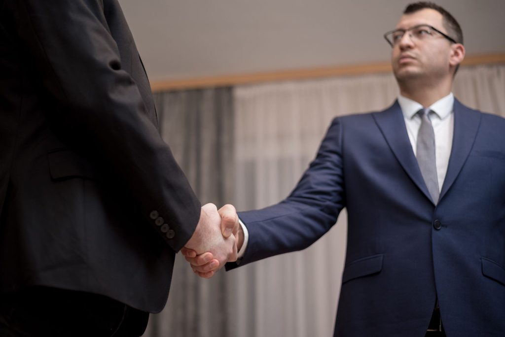 first big deal business handshake